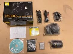 Nikon d5300 with 18-55mm af-p vr lens full box for only sale