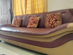 5 seater leather sofa set and 2 centre tables for sale