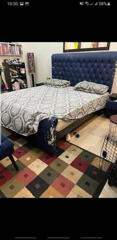 bed with side table and hanging dressing table