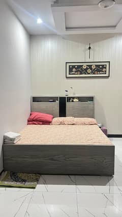 Bed with dressing and side tables