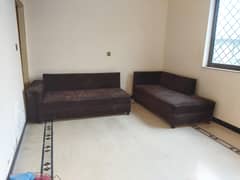 L-shaped 2 Sofa set with 1 table.