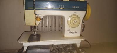 The Singer Deluxe Golden Girl 965 sewing machine