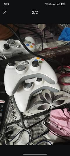 xbox 360 with two controllers