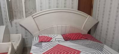 wooden bed, used