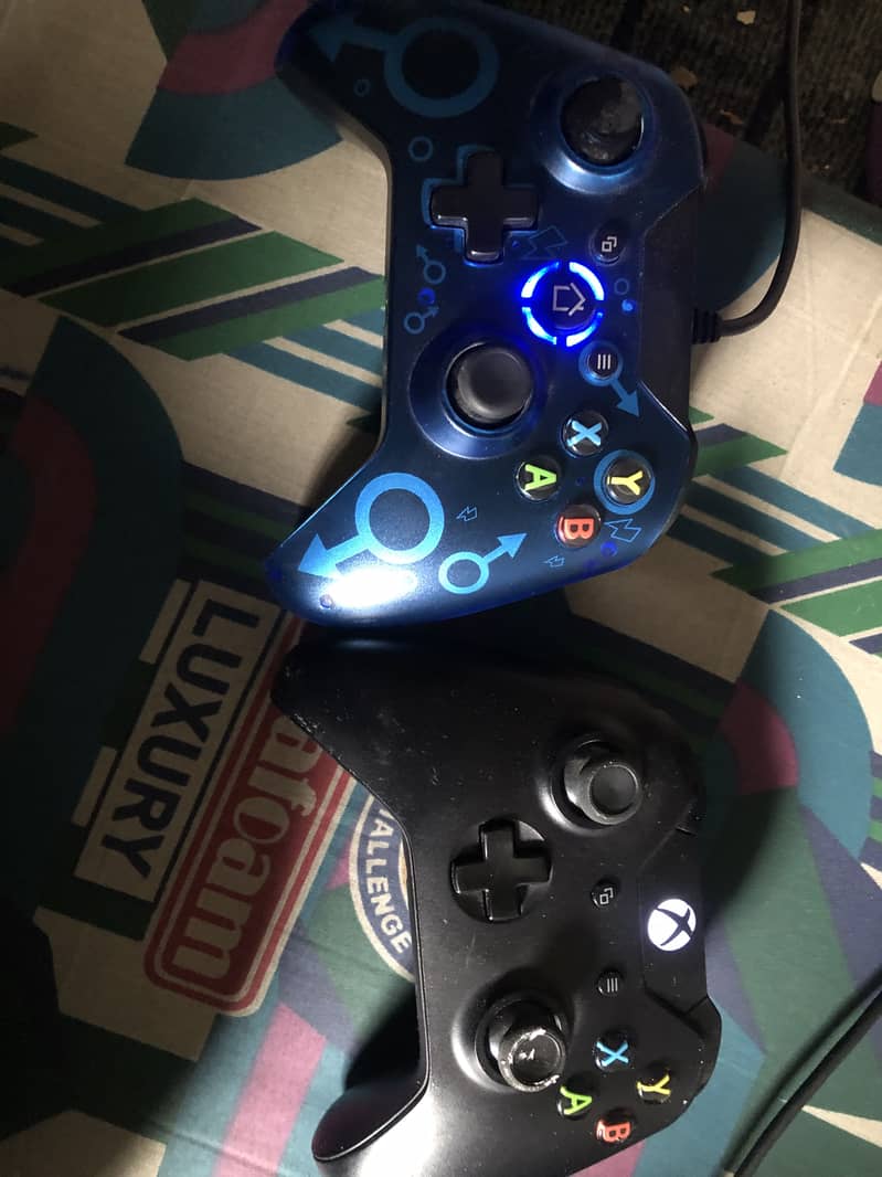 XBox One With one wired and one wireless controller 3
