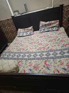 Wooden bed with head board