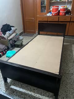 2 single wooden beds