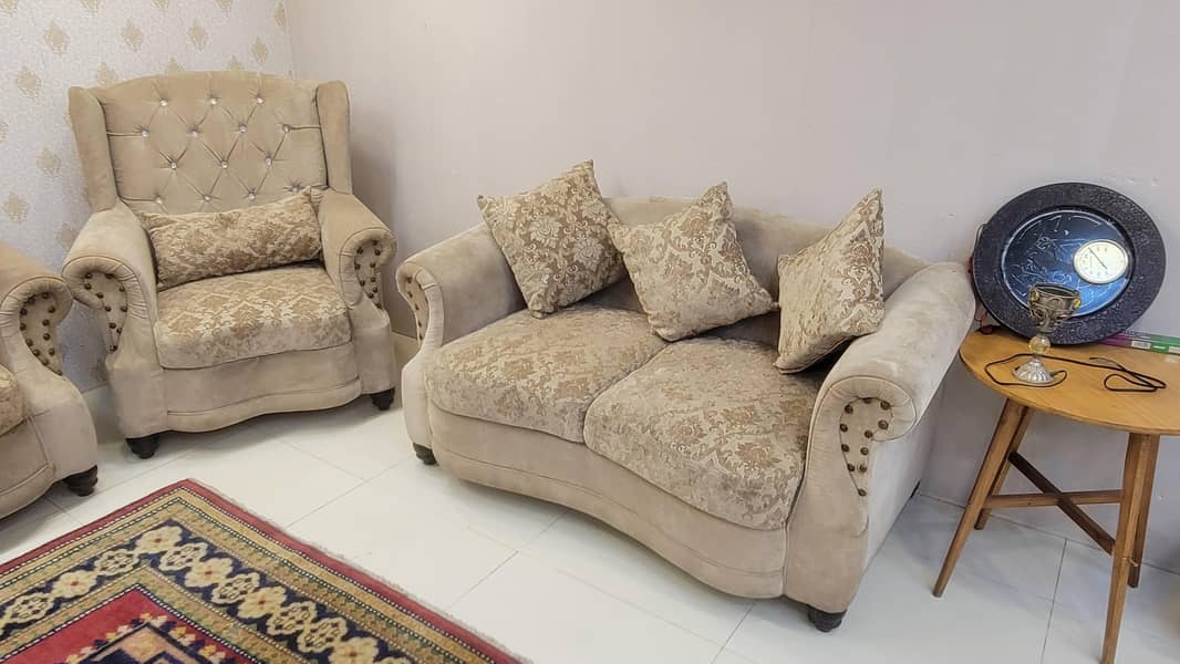 7 seater sofa with table and 4 stools 1