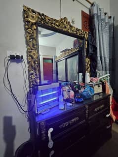 King size bed with two side tables and dressing table.