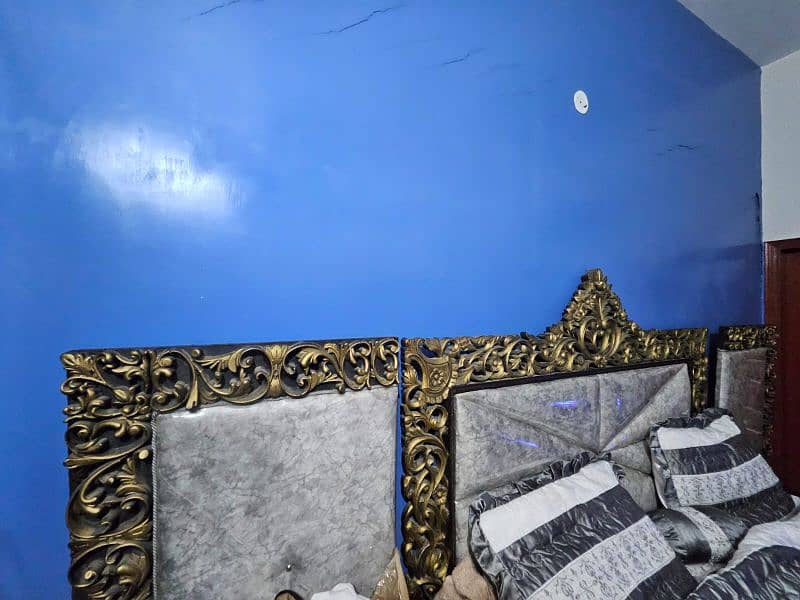 King size bed with two side tables and dressing table. 6