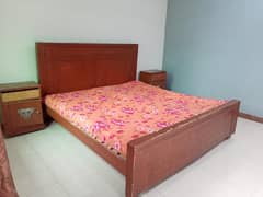 bed with mattress and side tables