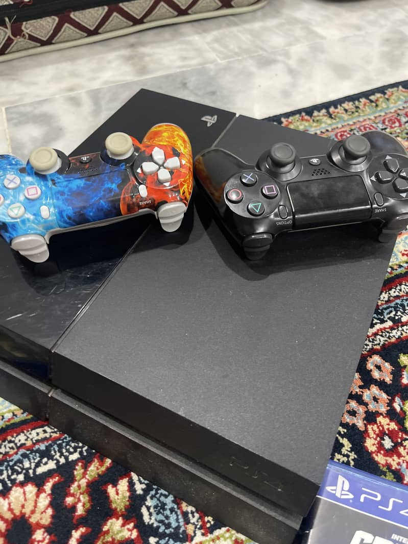 ps4 used , two controllers and one game gta 5 full new condition 2