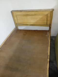 single wooden bed with meters