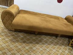 Bed and sofa. Window almari