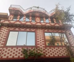 5 Marla double story house brand new home ideal and hot location carpet road near canal road near sozo water park water electricity Gass available 3D ultra model design Spanish look furnished home with wood work