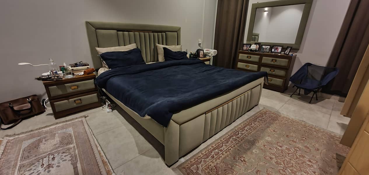 Queen sized bed with mattress and side tables and a dressing table. 1