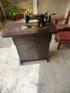 Sewing machine with a table