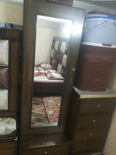 double bed and 2  side  tables with  a dressing table