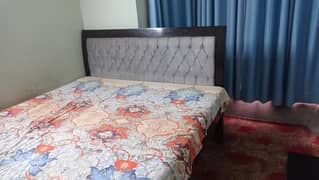 king size double bed with dressing, mirror and side tables
