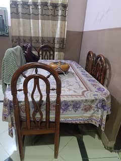 wood dinning table with 6 chairs in good condition