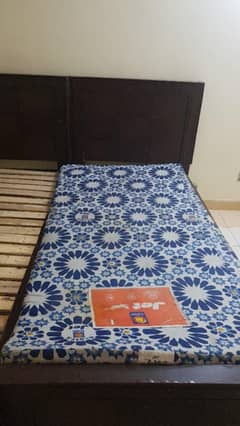 Wooden single bed