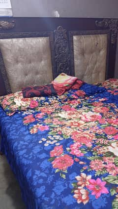 Double bed with one side table