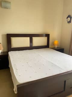 Bed with side tables