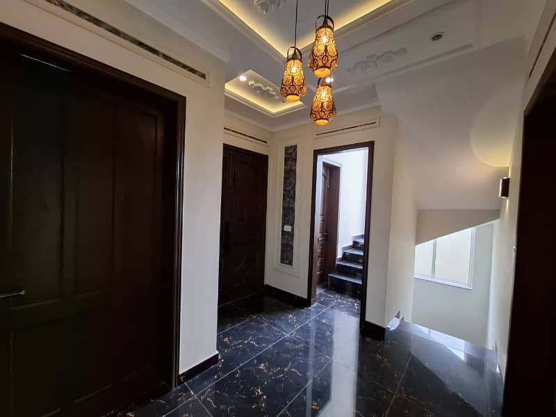 Elegant Triple-Story 10 Marla Home in DHA EME Block D with Distinct Spanish Elevation, Functional Basement with Drawing Room & Study, Separate Side Stair Access for Privacy, and High-Quality Construction by Build Force 2