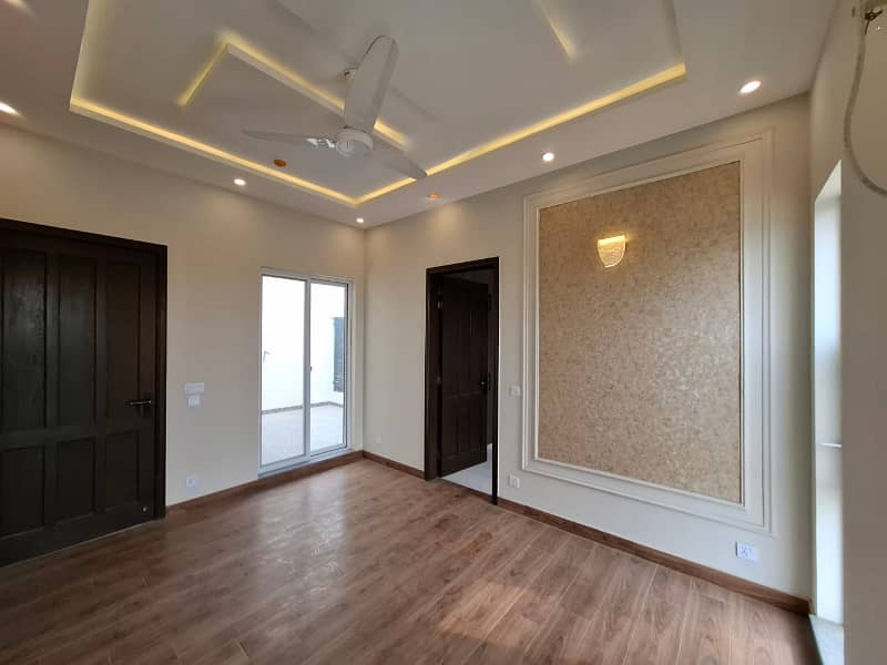 Elegant Triple-Story 10 Marla Home in DHA EME Block D with Distinct Spanish Elevation, Functional Basement with Drawing Room & Study, Separate Side Stair Access for Privacy, and High-Quality Construction by Build Force 3