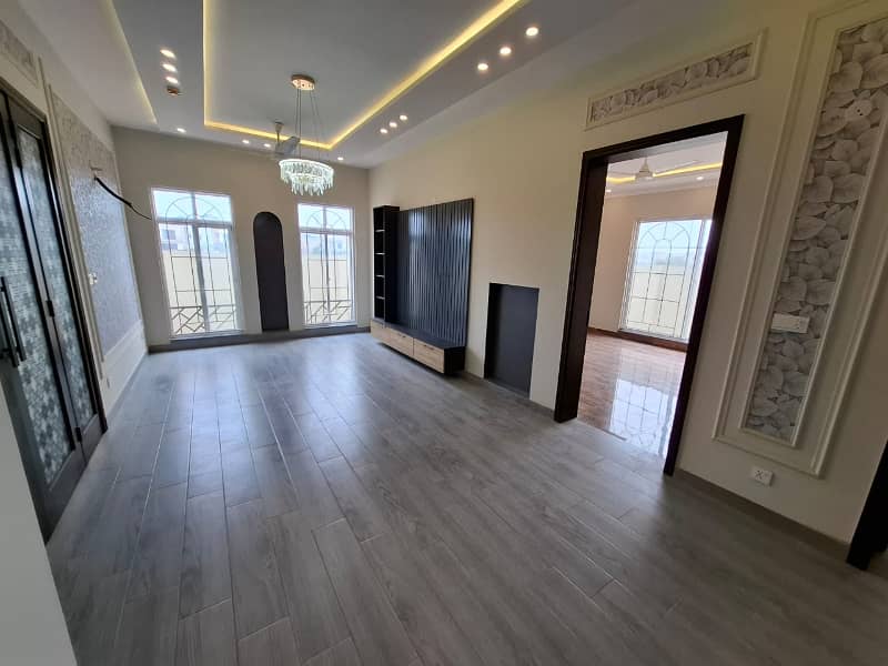 Elegant Triple-Story 10 Marla Home in DHA EME Block D with Distinct Spanish Elevation, Functional Basement with Drawing Room & Study, Separate Side Stair Access for Privacy, and High-Quality Construction by Build Force 8