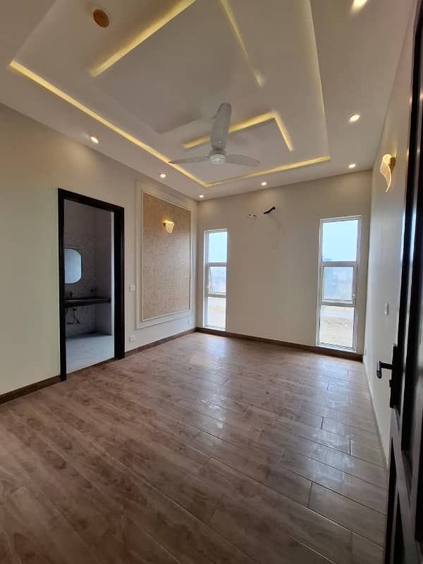 Elegant Triple-Story 10 Marla Home in DHA EME Block D with Distinct Spanish Elevation, Functional Basement with Drawing Room & Study, Separate Side Stair Access for Privacy, and High-Quality Construction by Build Force 9