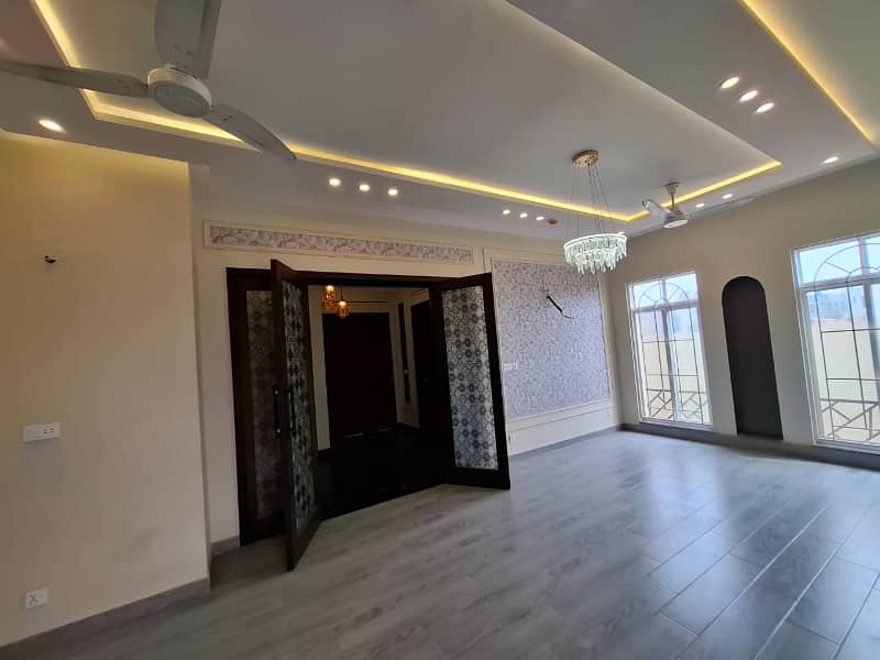 Elegant Triple-Story 10 Marla Home in DHA EME Block D with Distinct Spanish Elevation, Functional Basement with Drawing Room & Study, Separate Side Stair Access for Privacy, and High-Quality Construction by Build Force 10