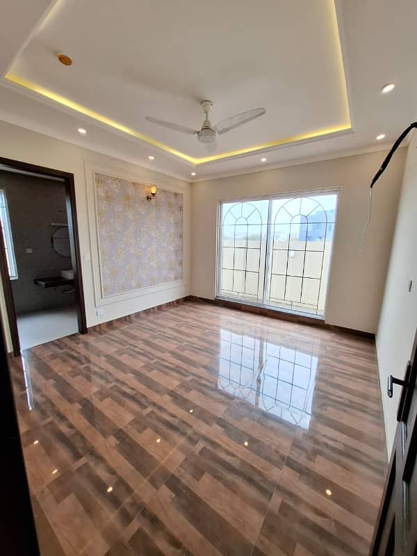 Elegant Triple-Story 10 Marla Home in DHA EME Block D with Distinct Spanish Elevation, Functional Basement with Drawing Room & Study, Separate Side Stair Access for Privacy, and High-Quality Construction by Build Force 11