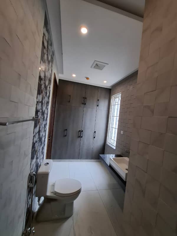 Elegant Triple-Story 10 Marla Home in DHA EME Block D with Distinct Spanish Elevation, Functional Basement with Drawing Room & Study, Separate Side Stair Access for Privacy, and High-Quality Construction by Build Force 12