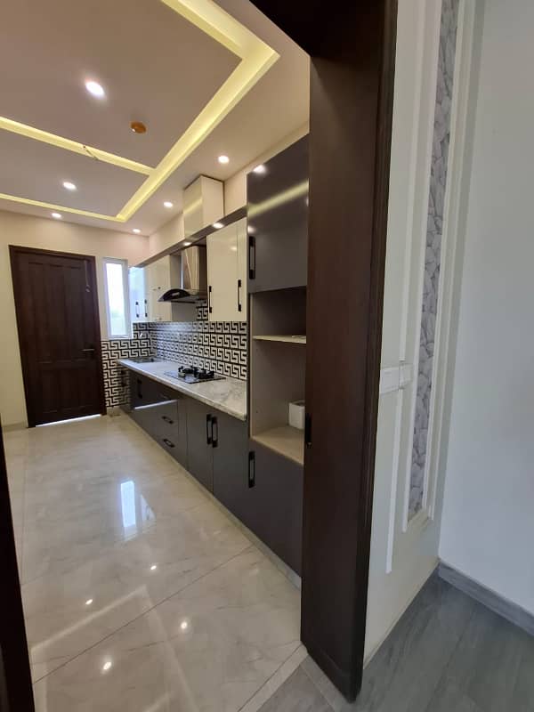 Elegant Triple-Story 10 Marla Home in DHA EME Block D with Distinct Spanish Elevation, Functional Basement with Drawing Room & Study, Separate Side Stair Access for Privacy, and High-Quality Construction by Build Force 14