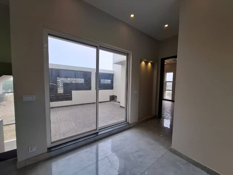 Elegant Triple-Story 10 Marla Home in DHA EME Block D with Distinct Spanish Elevation, Functional Basement with Drawing Room & Study, Separate Side Stair Access for Privacy, and High-Quality Construction by Build Force 21