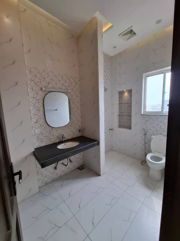 Elegant Triple-Story 10 Marla Home in DHA EME Block D with Distinct Spanish Elevation, Functional Basement with Drawing Room & Study, Separate Side Stair Access for Privacy, and High-Quality Construction by Build Force 24