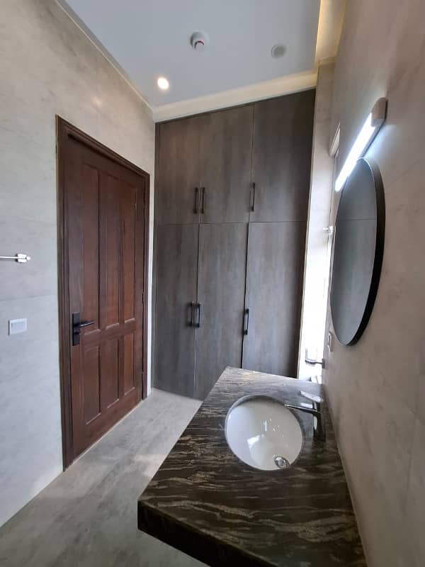 Elegant Triple-Story 10 Marla Home in DHA EME Block D with Distinct Spanish Elevation, Functional Basement with Drawing Room & Study, Separate Side Stair Access for Privacy, and High-Quality Construction by Build Force 26