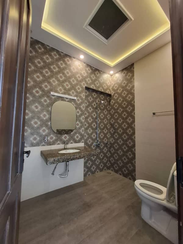Elegant Triple-Story 10 Marla Home in DHA EME Block D with Distinct Spanish Elevation, Functional Basement with Drawing Room & Study, Separate Side Stair Access for Privacy, and High-Quality Construction by Build Force 31