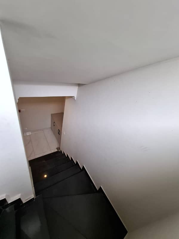 Elegant Triple-Story 10 Marla Home in DHA EME Block D with Distinct Spanish Elevation, Functional Basement with Drawing Room & Study, Separate Side Stair Access for Privacy, and High-Quality Construction by Build Force 32