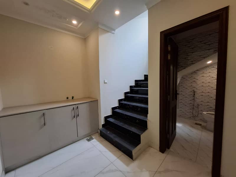 Elegant Triple-Story 10 Marla Home in DHA EME Block D with Distinct Spanish Elevation, Functional Basement with Drawing Room & Study, Separate Side Stair Access for Privacy, and High-Quality Construction by Build Force 38