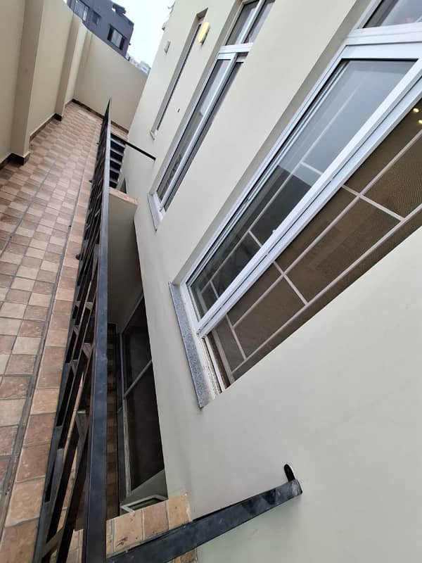 Elegant Triple-Story 10 Marla Home in DHA EME Block D with Distinct Spanish Elevation, Functional Basement with Drawing Room & Study, Separate Side Stair Access for Privacy, and High-Quality Construction by Build Force 39