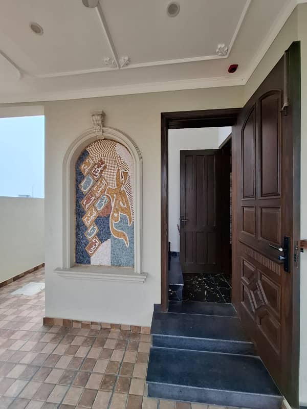 Elegant Triple-Story 10 Marla Home in DHA EME Block D with Distinct Spanish Elevation, Functional Basement with Drawing Room & Study, Separate Side Stair Access for Privacy, and High-Quality Construction by Build Force 41