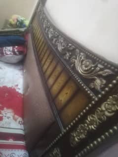 Queen size bed with side table and dressing table