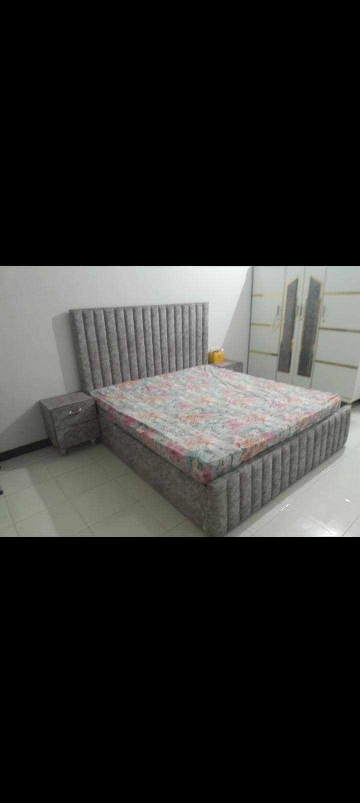 A king size bed with two side tables 2