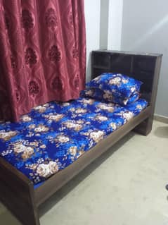 single bed with storage headboard