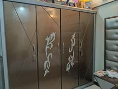 king size bed with cupboard and dressing table