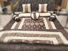 brown skin bedsheet with comforter
