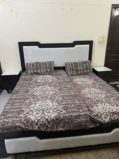 White and black wooden bed