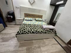 White king size bed with side tables